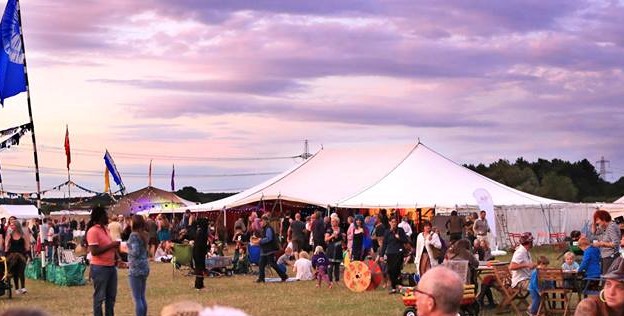 Big top marquee at a boutique festival at sunset