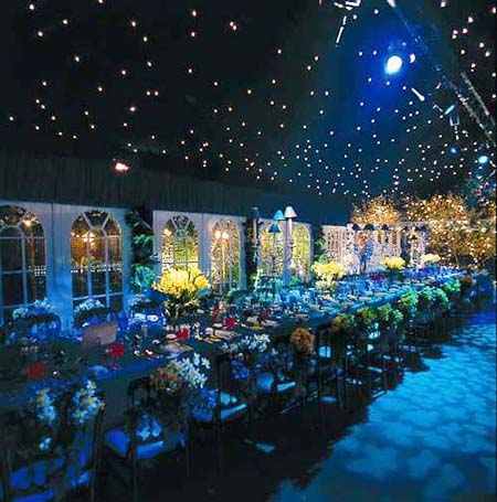 Marquee dinner under a fairy-light starlit ceiling