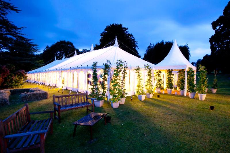 Marquee and gardens glowing at twilight